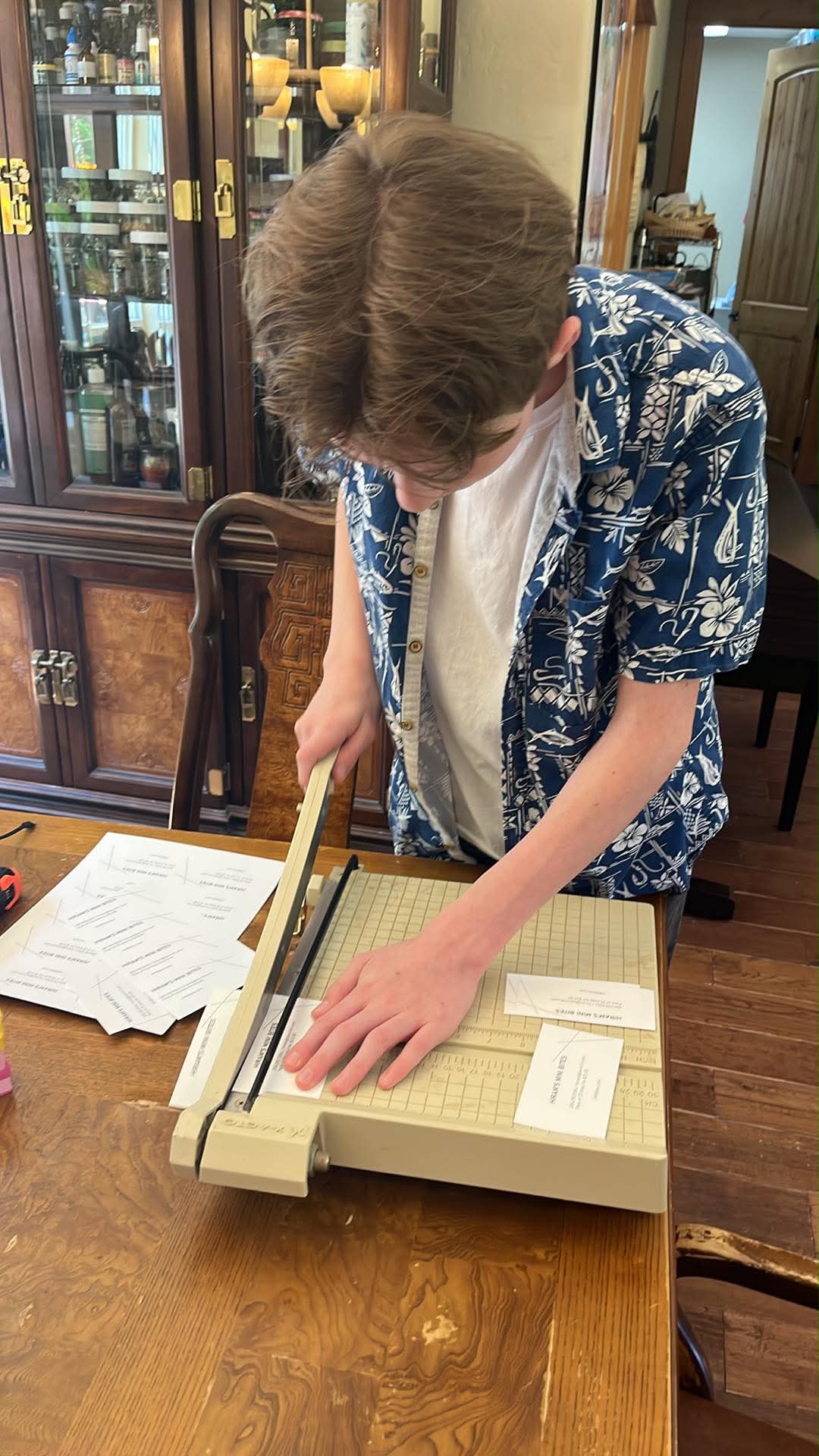 Hiram trimming his Mini Bites labels by hand